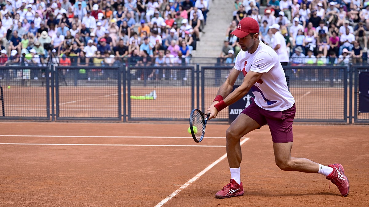 Novak Djokovic wears bicycle helmet to Italian Open training session after getting hit in the head with bottle
