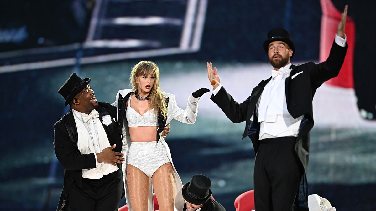 Travis Kelce appears to wipe away tears as Brittany Mahomes comforts him during Taylor Swift Eras Tour stop