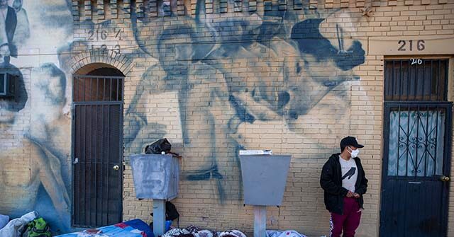 Migrants Camp in City Streets as Biden’s Shelters Overflow and Gang Violence Grows