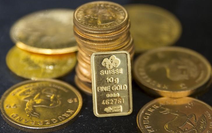 Gold prices hit a fresh record high as Trump tariffs add safe-haven demand