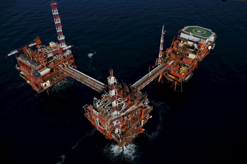 Oil prices slide to 4-yr low as Trump tariffs ramp up demand fears