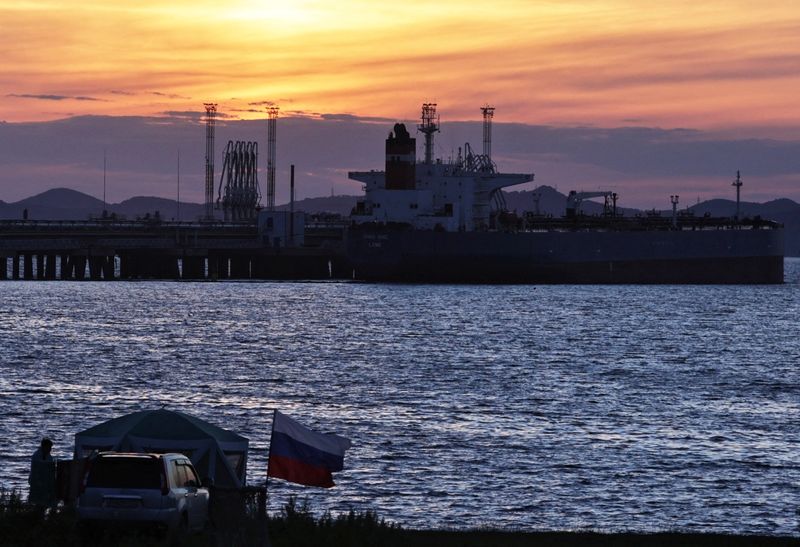Oil edges up but heads for weekly fall under supply pressure